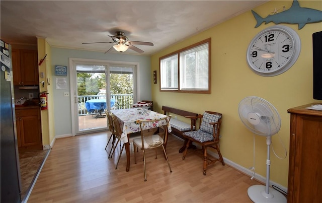 22 Sandy Ln, Westerly, RI 02891 - dining space featuring light wood-style flooring, a ceiling fan, and baseboards