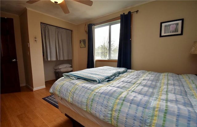 22 Sandy Ln, Westerly, RI 02891 - bedroom featuring light wood-style flooring, crown molding, baseboards, and ceiling fan