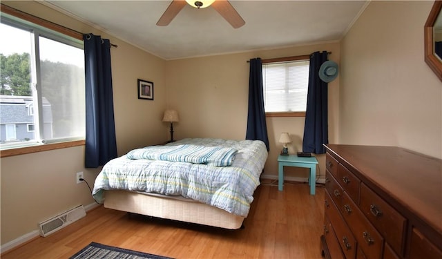 22 Sandy Ln, Westerly, RI 02891 - bedroom featuring light wood-style flooring, crown molding, baseboards, and a ceiling fan