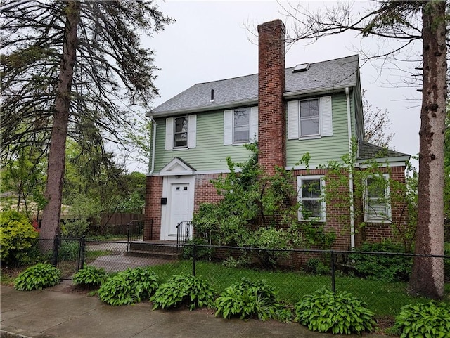 33 Zella St, Providence, RI 02908 - view of front of home with brick siding and a chimney