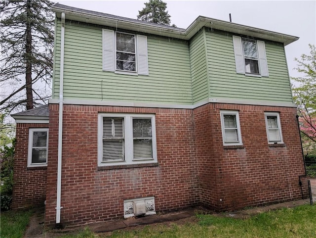 33 Zella St, Providence, RI 02908 - view of side of home featuring brick siding