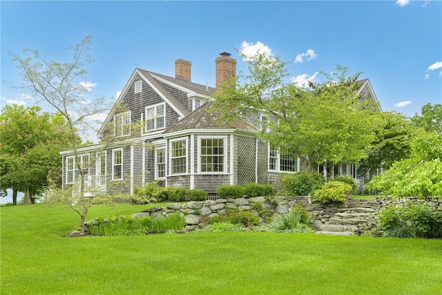 576 W Main Rd, Little Compton, RI 02837 - rear view of house featuring a yard and a chimney