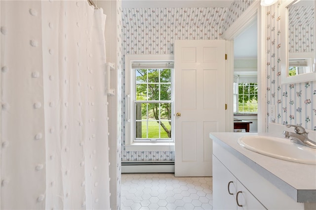 576 W Main Rd, Little Compton, RI 02837 - bathroom featuring wallpapered walls, baseboard heating, vanity, and healthy amount of natural light