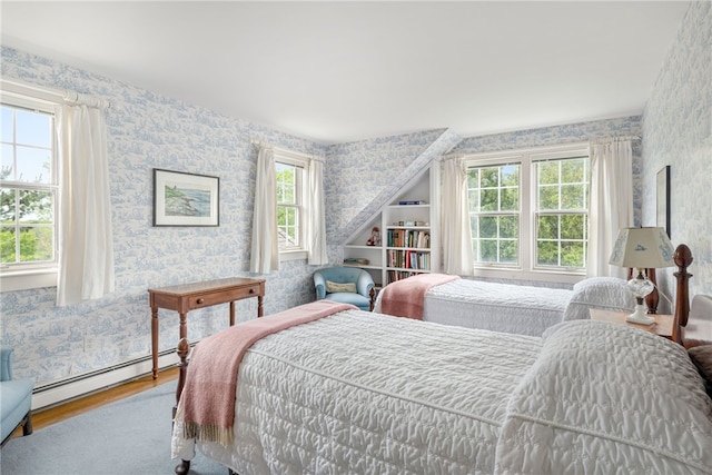 576 W Main Rd, Little Compton, RI 02837 - bedroom with wallpapered walls, wood finished floors, and a baseboard heating unit