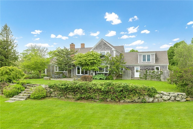 576 W Main Rd, Little Compton, RI 02837 - view of front facade featuring a front lawn and a chimney