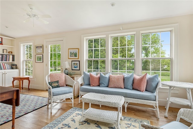 576 W Main Rd, Little Compton, RI 02837 - living room featuring light wood-type flooring, a ceiling fan, and baseboards