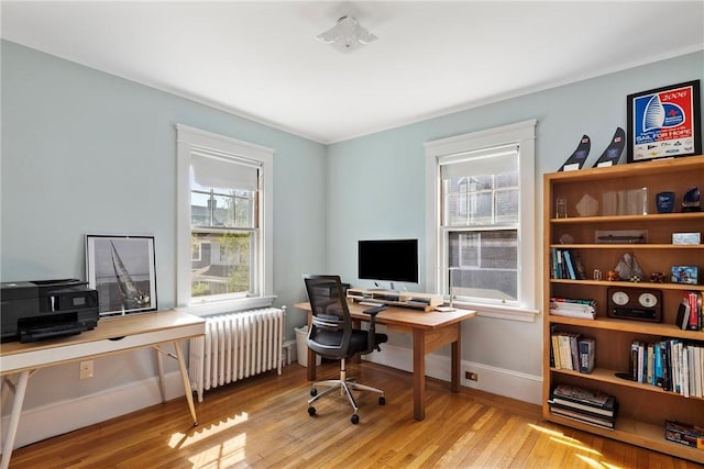 27 Cranston Ave, Newport, RI 02840 - home office featuring radiator heating unit, wood finished floors, and baseboards