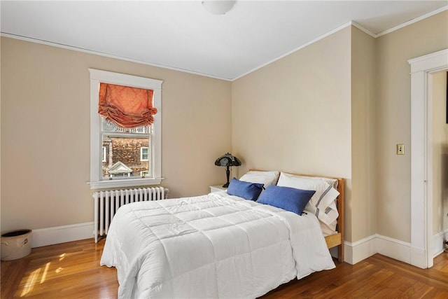 27 Cranston Ave, Newport, RI 02840 - bedroom featuring radiator heating unit, ornamental molding, wood finished floors, and baseboards