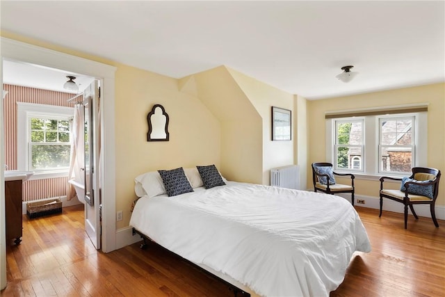 27 Cranston Ave, Newport, RI 02840 - bedroom with radiator heating unit, multiple windows, hardwood / wood-style flooring, and baseboards