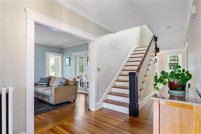 27 Cranston Ave, Newport, RI 02840 - stairs with radiator, wood finished floors, baseboards, and ornamental molding
