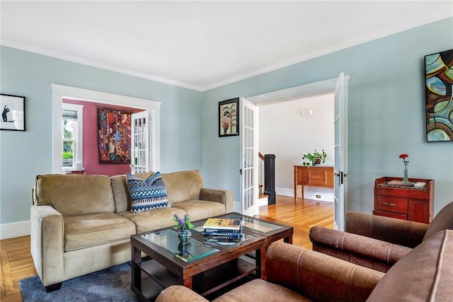 27 Cranston Ave, Newport, RI 02840 - living room featuring crown molding, baseboards, french doors, and wood finished floors