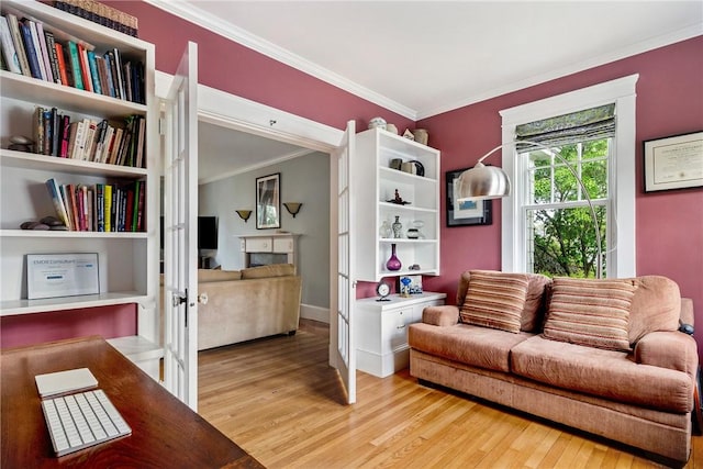27 Cranston Ave, Newport, RI 02840 - living area featuring crown molding, light wood finished floors, a fireplace, and baseboards