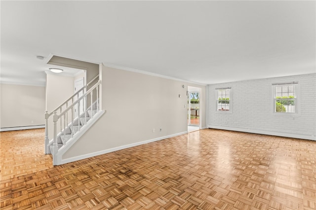 39 Exeter Blvd, Narragansett, RI 02882 - unfurnished living room with baseboards, a baseboard heating unit, brick wall, ornamental molding, and stairway