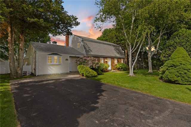 39 Exeter Blvd, Narragansett, RI 02882 - dutch colonial featuring driveway, a chimney, a lawn, roof with shingles, and a gambrel roof