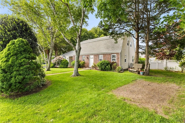39 Exeter Blvd, Narragansett, RI 02882 - rear view of house featuring a gambrel roof, roof with shingles, and brick siding