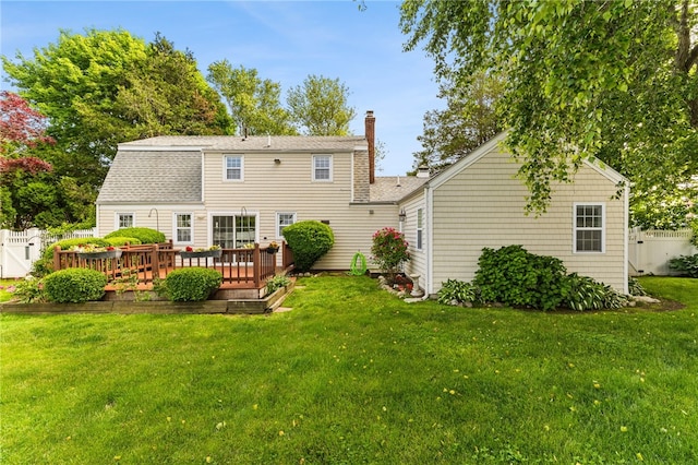 39 Exeter Blvd, Narragansett, RI 02882 - back of property with a chimney, a deck, and roof with shingles