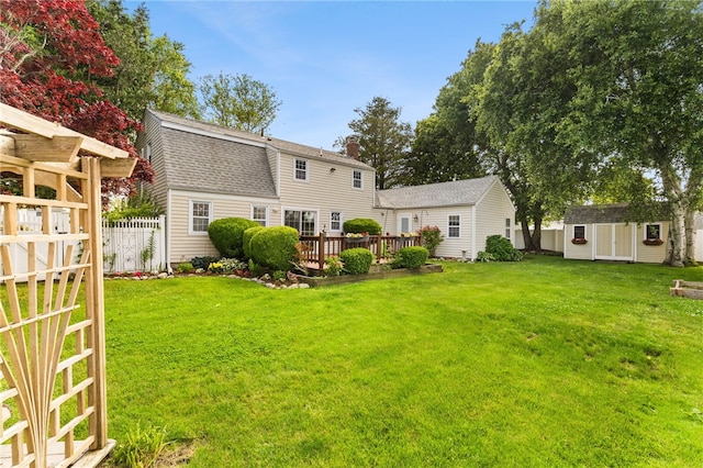 39 Exeter Blvd, Narragansett, RI 02882 - rear view of house with a shingled roof, a deck, and a chimney