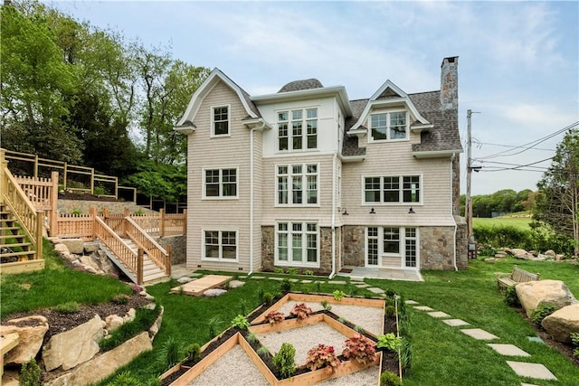 17 E Hills Rd, Westerly, RI 02891 - back of house with a vegetable garden, stairway, a yard, a chimney, and a shingled roof