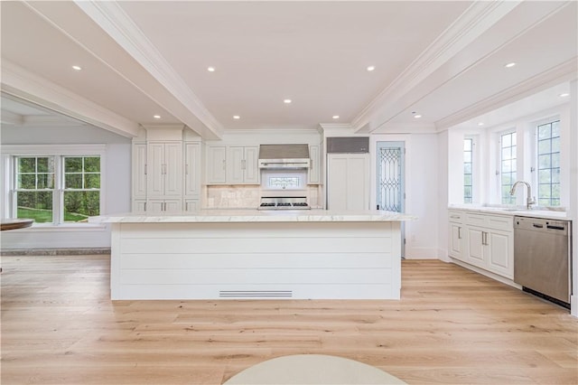 17 E Hills Rd, Westerly, RI 02891 - kitchen with dishwasher, wall chimney range hood, light countertops, crown molding, and a center island