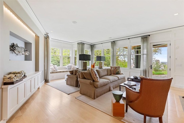25 Walnut St, Jamestown, RI 02835 - living room featuring healthy amount of natural light, light wood finished floors, crown molding, and recessed lighting
