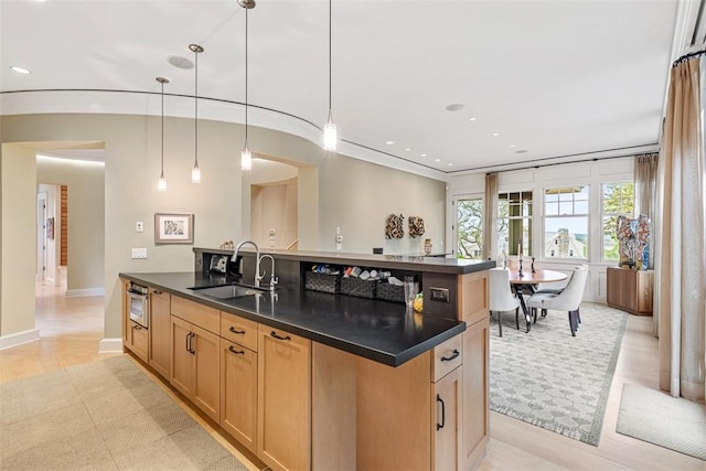 25 Walnut St, Jamestown, RI 02835 - kitchen featuring a sink, dark countertops, recessed lighting, a kitchen island with sink, and pendant lighting