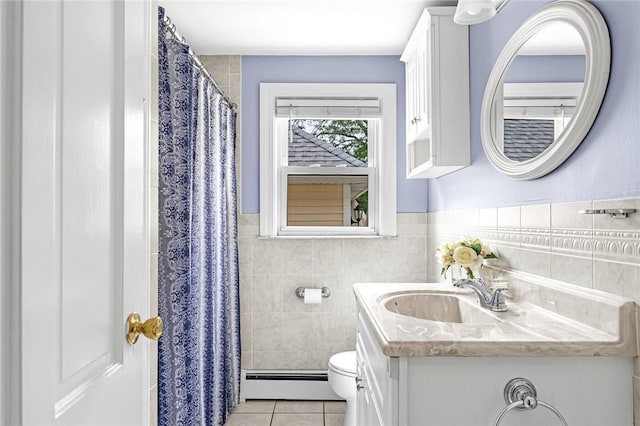 33 Upland Way, Barrington, RI 02806 - bathroom featuring a baseboard radiator, tile walls, tile patterned flooring, vanity, and a wainscoted wall