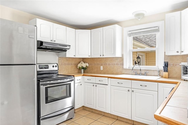 33 Upland Way, Barrington, RI 02806 - kitchen featuring stainless steel appliances, under cabinet range hood, light countertops, and white cabinets