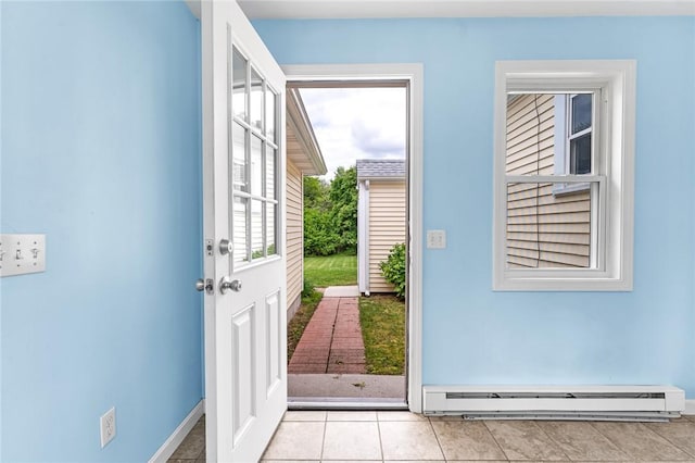 33 Upland Way, Barrington, RI 02806 - doorway to outside with a baseboard heating unit and light tile patterned floors