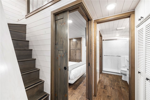 12 Alexander Cir Unit Th2, Richmond, RI 02898 - corridor with wooden walls, dark wood finished floors, and stairs