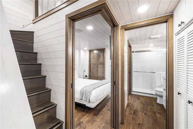 12 Alexander Cir Unit Th2, Richmond, RI 02898 - bedroom featuring dark wood-style flooring, wooden walls, recessed lighting, and connected bathroom