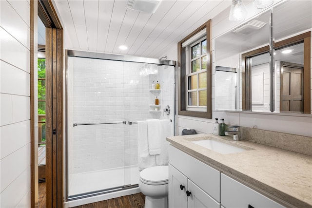 12 Alexander Cir Unit Th2, Richmond, RI 02898 - bathroom featuring vanity, a stall shower, toilet, wood finished floors, and recessed lighting
