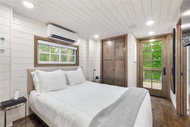 12 Alexander Cir Unit Th2, Richmond, RI 02898 - bedroom with an AC wall unit, dark wood-style floors, recessed lighting, and wooden walls