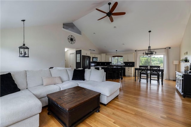 38 Pleasant View Dr, Hopkinton, RI 02832 - living room featuring a ceiling fan, high vaulted ceiling, light wood-style flooring, and a chandelier