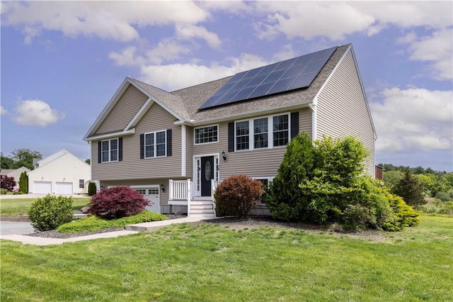 38 Pleasant View Dr, Hopkinton, RI 02832 - split foyer home with a front yard, solar panels, a shingled roof, and an attached garage