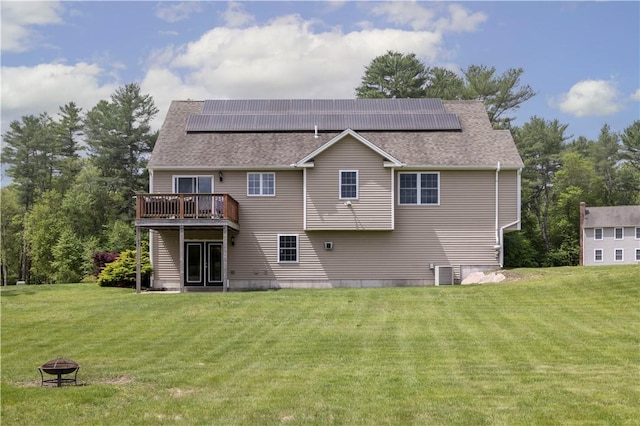 38 Pleasant View Dr, Hopkinton, RI 02832 - back of property featuring a yard, cooling unit, roof mounted solar panels, and a deck