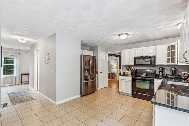 121 Greenbush Rd, Warwick, RI 02818 - kitchen with black appliances, a sink, light tile patterned floors, and white cabinets