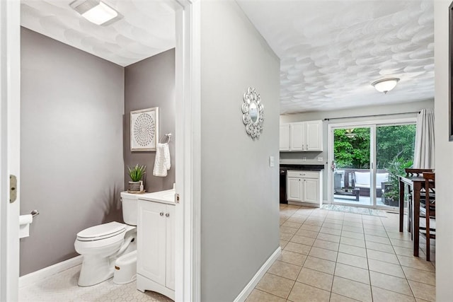121 Greenbush Rd, Warwick, RI 02818 - bathroom with toilet, tile patterned flooring, baseboards, and vanity