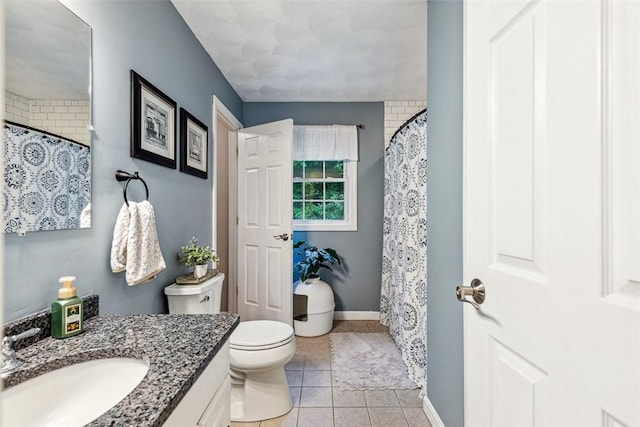 121 Greenbush Rd, Warwick, RI 02818 - full bath featuring vanity, toilet, baseboards, tile patterned flooring, and a shower with curtain