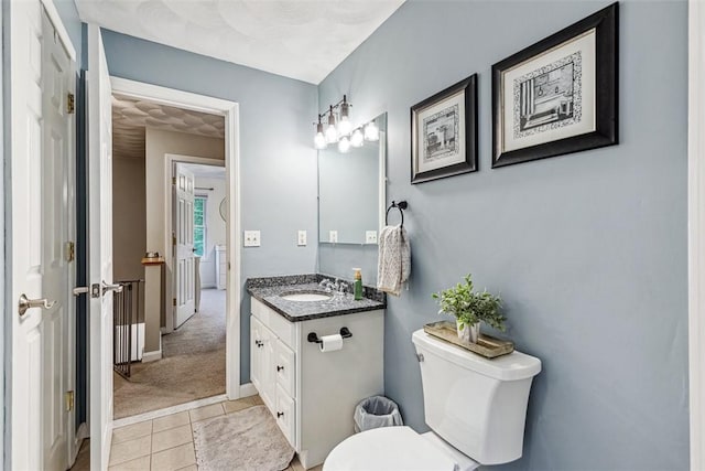 121 Greenbush Rd, Warwick, RI 02818 - bathroom with vanity, tile patterned floors, toilet, and baseboards