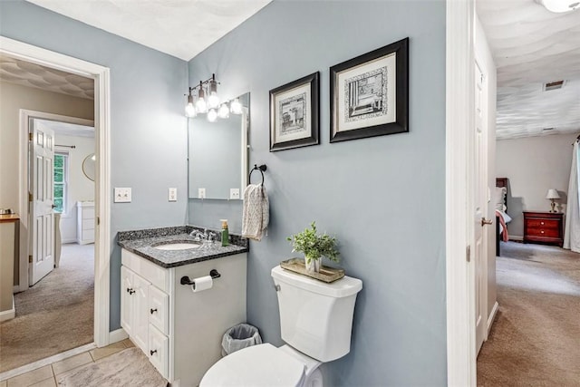 121 Greenbush Rd, Warwick, RI 02818 - bathroom featuring vanity, tile patterned flooring, toilet, and baseboards