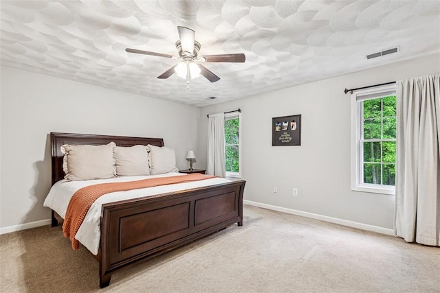 121 Greenbush Rd, Warwick, RI 02818 - bedroom with multiple windows, baseboards, and light carpet