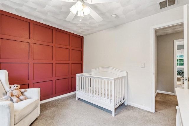 121 Greenbush Rd, Warwick, RI 02818 - bedroom featuring light carpet, a decorative wall, baseboards, and ceiling fan