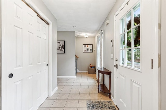 121 Greenbush Rd, Warwick, RI 02818 - doorway featuring light tile patterned floors and baseboards