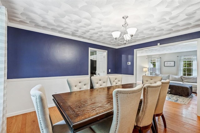 121 Greenbush Rd, Warwick, RI 02818 - dining area featuring a chandelier, wood finished floors, and ornamental molding