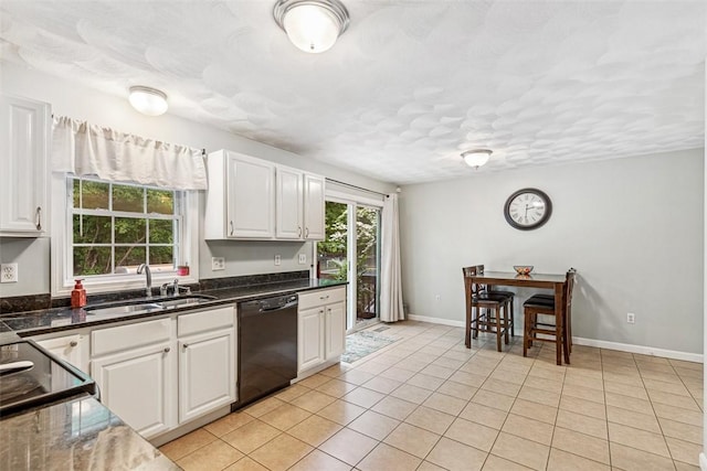 121 Greenbush Rd, Warwick, RI 02818 - kitchen featuring black appliances, a sink, white cabinetry, light tile patterned flooring, and baseboards