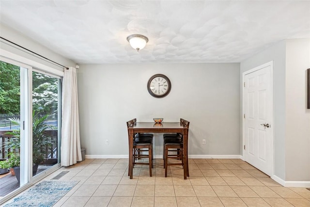 121 Greenbush Rd, Warwick, RI 02818 - dining room with light tile patterned floors and baseboards