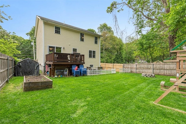 121 Greenbush Rd, Warwick, RI 02818 - back of house featuring a garden and a wooden deck