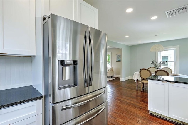 101 Knollwood Ave, Cranston, RI 02910 - kitchen with stainless steel fridge with ice dispenser, dark countertops, plenty of natural light, white cabinetry, and recessed lighting