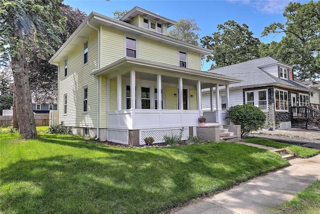 101 Knollwood Ave, Cranston, RI 02910 - american foursquare style home featuring a porch and a front lawn