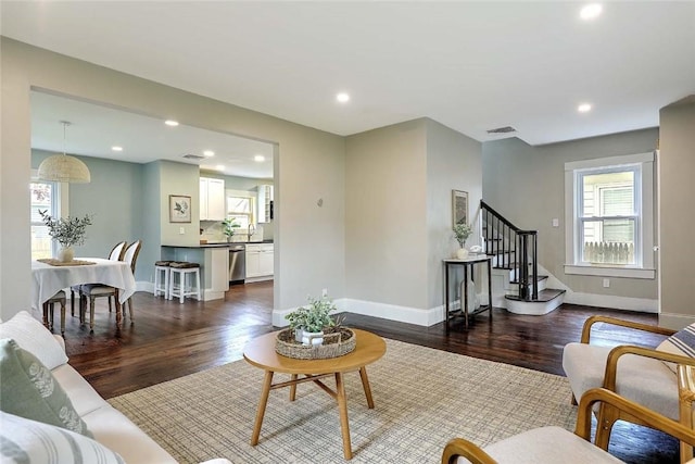 101 Knollwood Ave, Cranston, RI 02910 - living area with dark wood-type flooring, stairway, recessed lighting, and baseboards